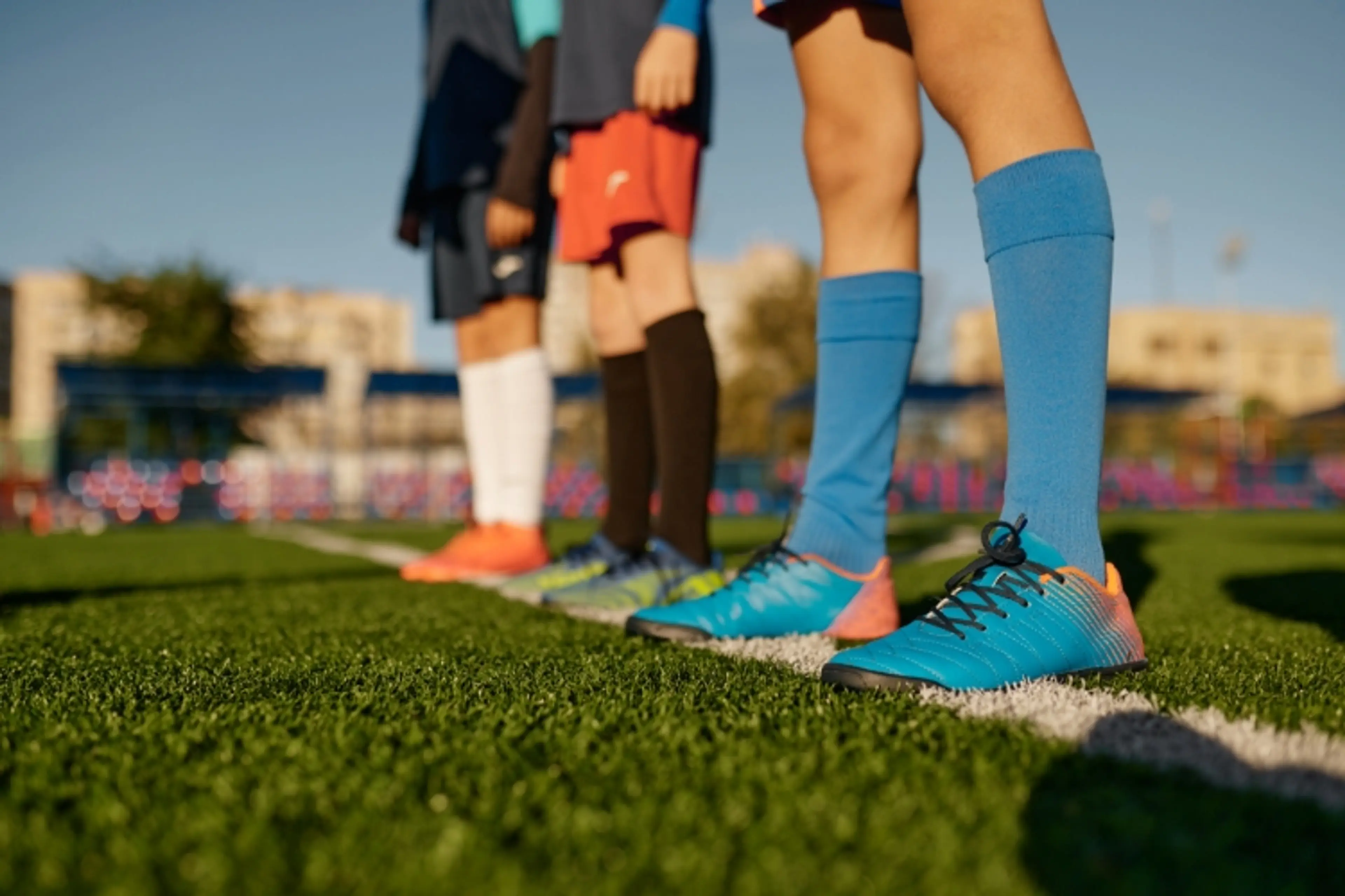 Children playing football artificial grass
