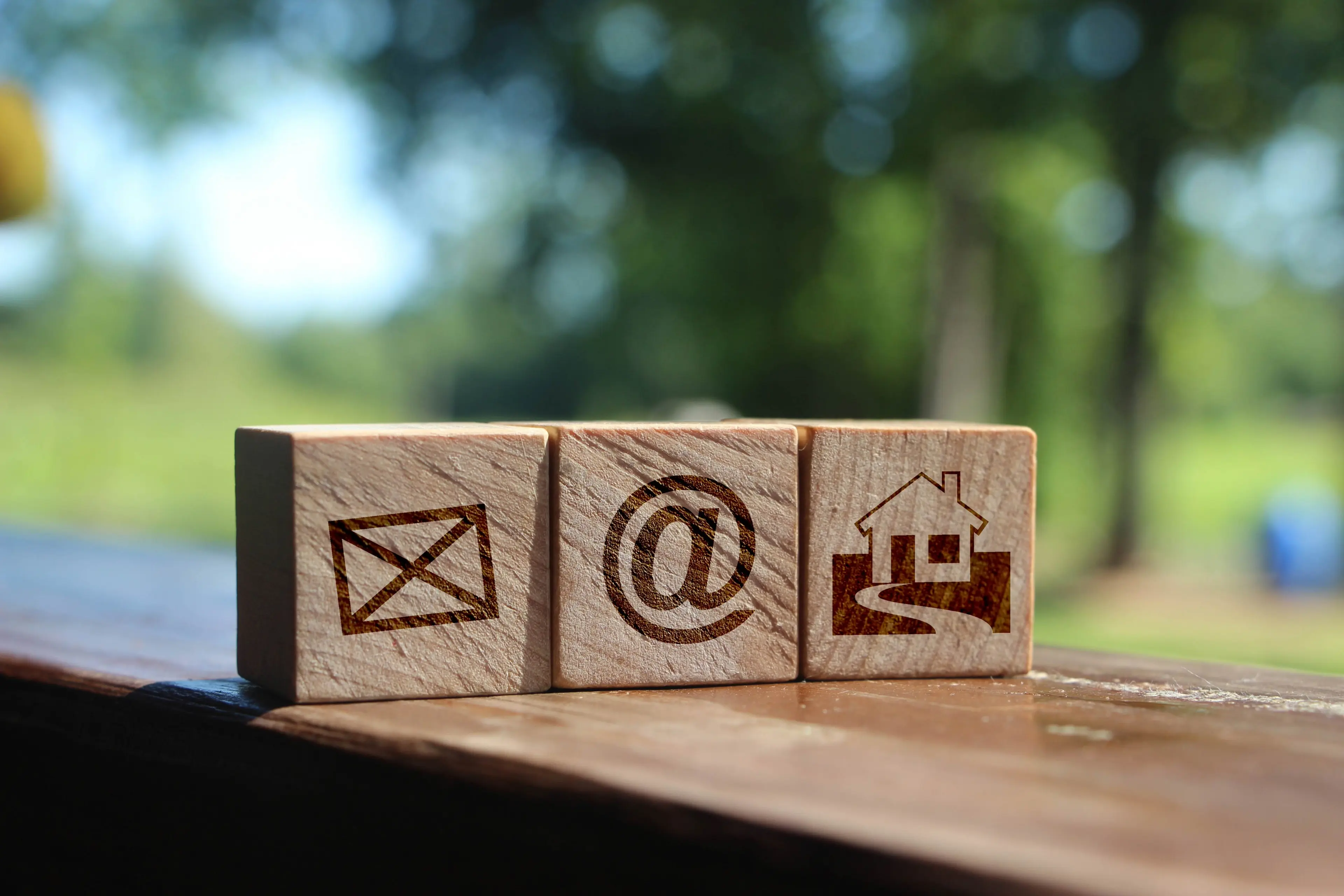 Contact us image using wooden blocks with icons