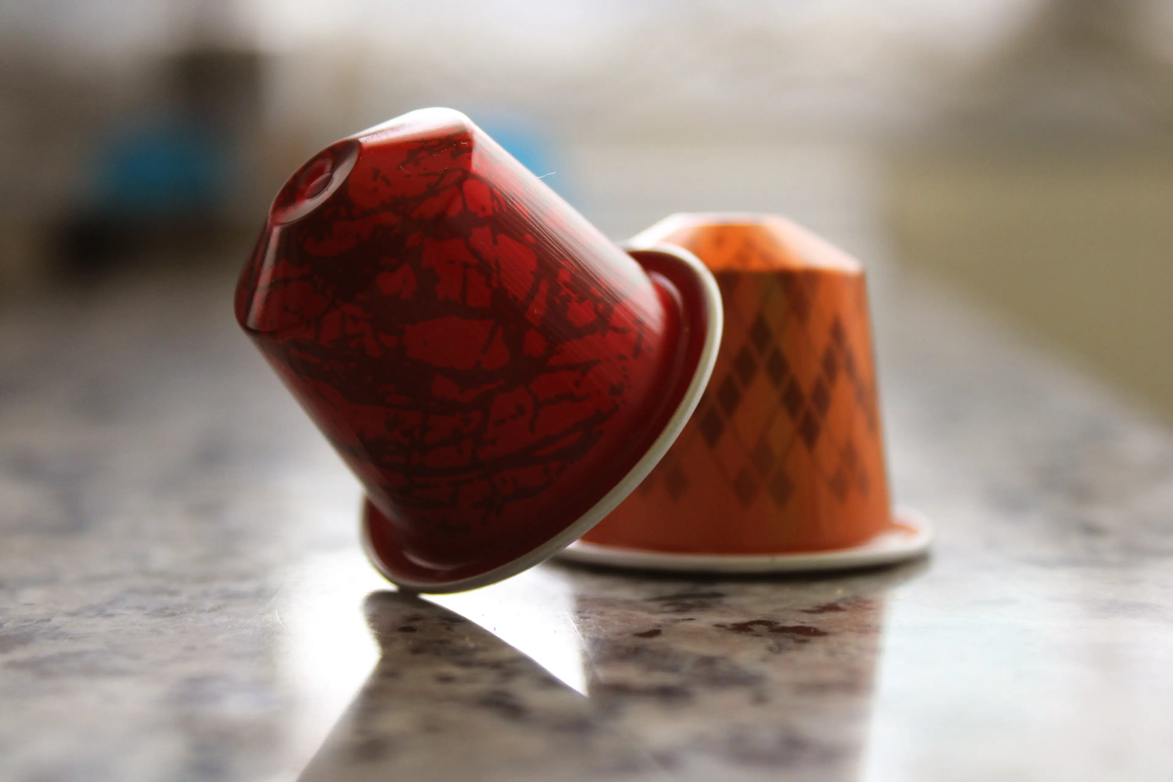 Image of two single serve coffee capsules on work surface