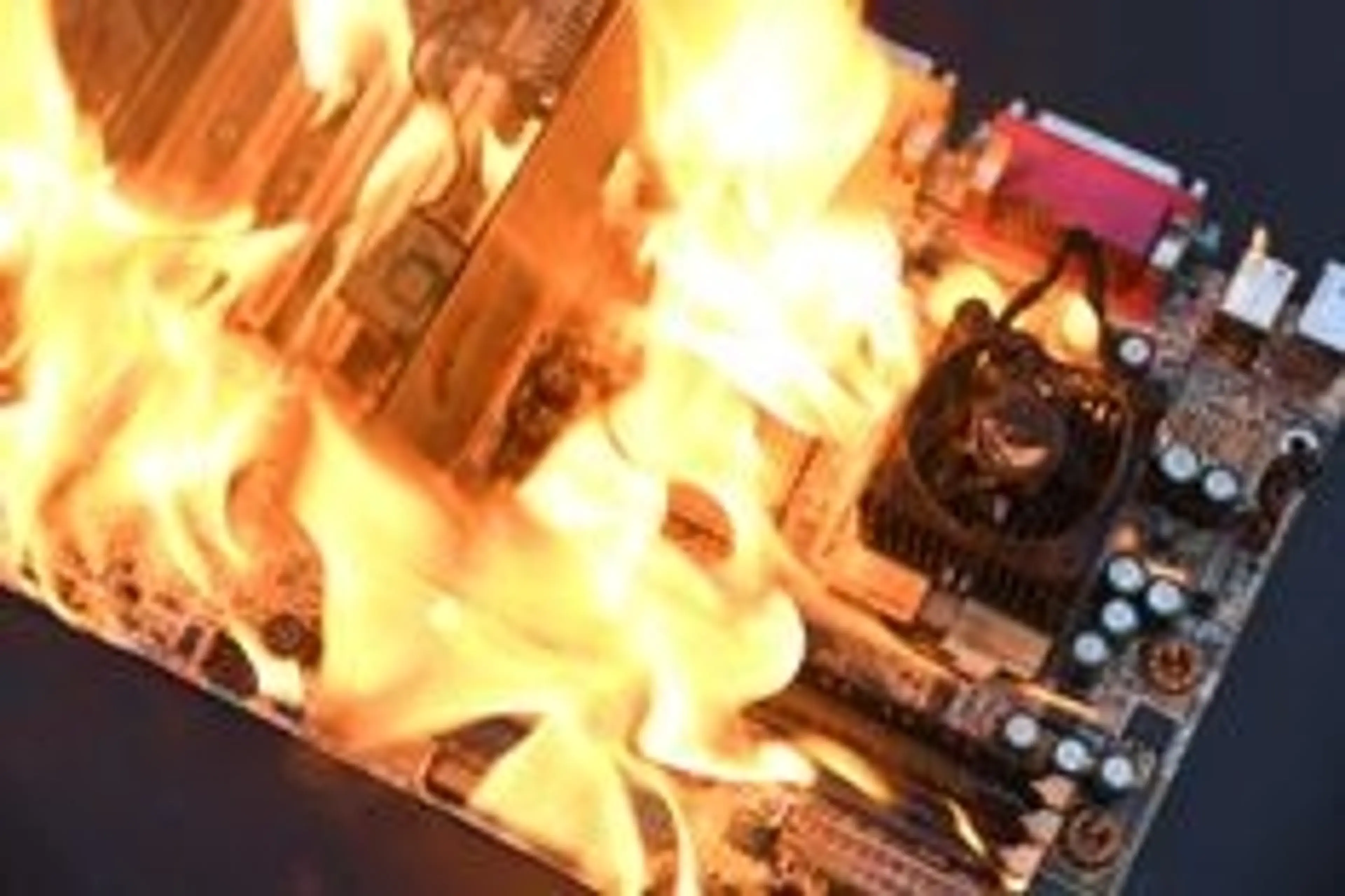 Image of circuit board on fire - dark background